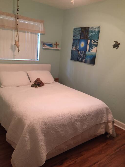 Bedroom #2 has a serene ocean decor with a queen size bed.