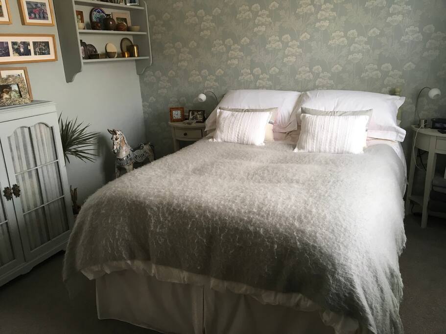 double bedded room with TV, fan, iPhone charger and hairdryer