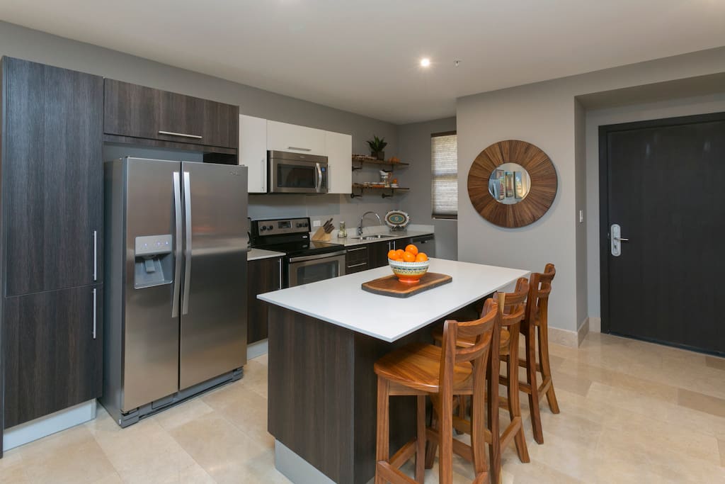 High end kitchen with island bar, fully equipped