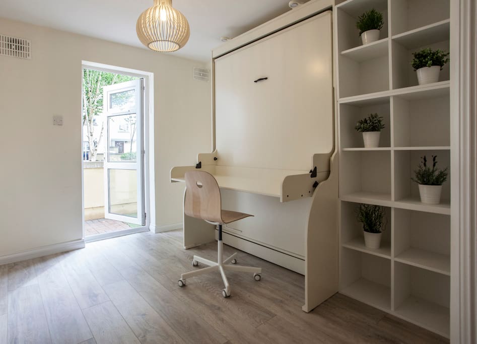 Second bedroom. A beautiful and bright room overlooking the garden. Can be used as an office, bedroom or even playroom. Whatever suites your convenience.
