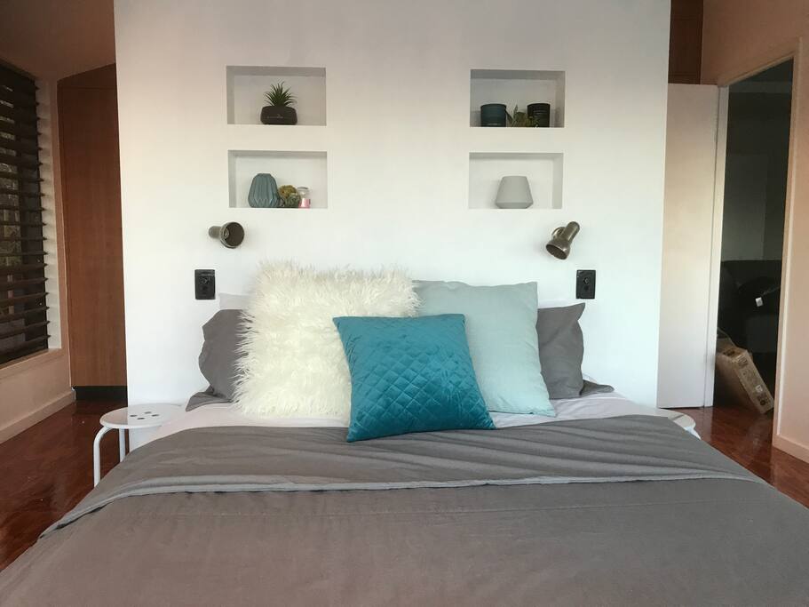 A comfy and beautiful queen-sized bed in a spacious Master Suite