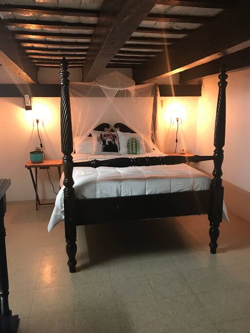 The room has two stories. With a mezzanie were the bed is. Also were to hang your clothes.