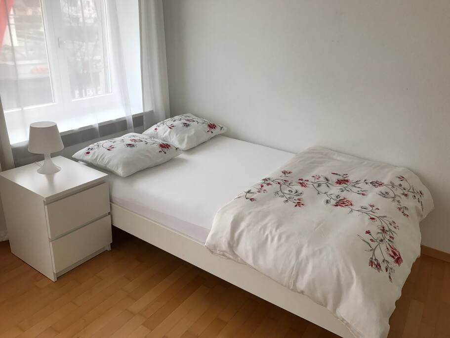 The room has 3 windows. It is bright and has a beautiful view.