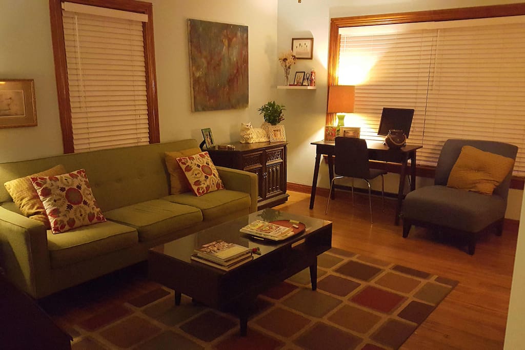 Comfortably sized living room with couch, desk, stereo, 32" TV, DVD player and Wii (not pictured, to the right across from couch.) Can accommodate a queen-sized air mattress.