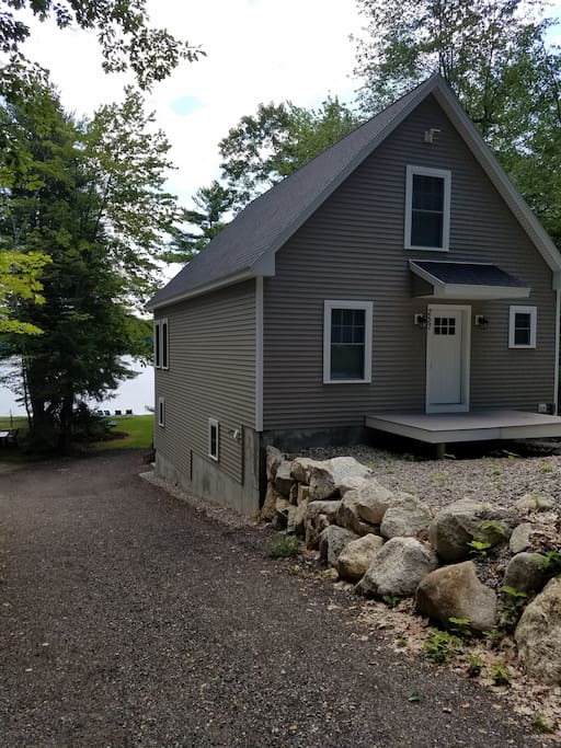 The house from the road, with the lake behind it