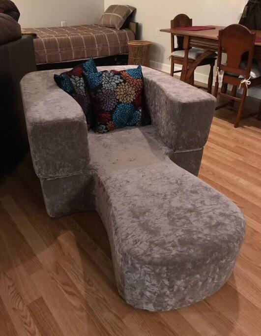 Foam cot or lounge chair. Just fold the arms down to make a comfortable sleeping cot.