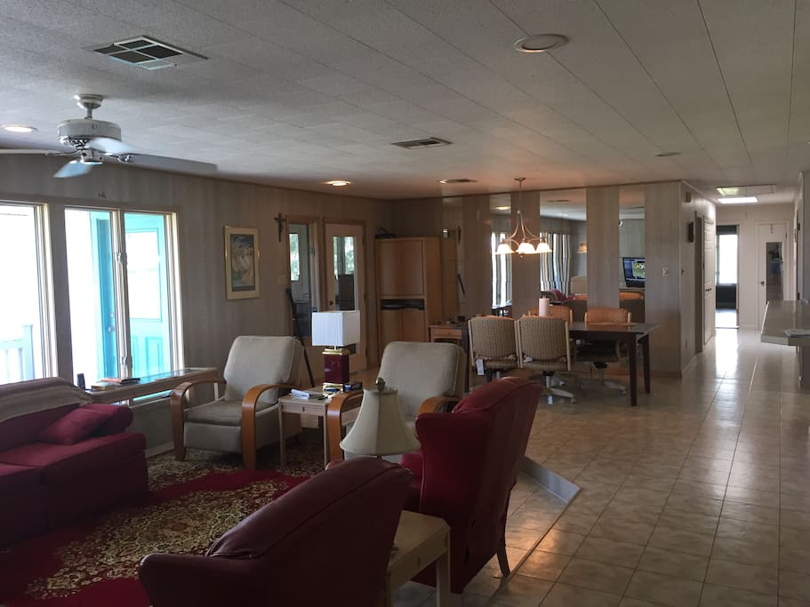 A Shot of the Living Room and Hallway Leading To Bathroom and Bedrooms. A very comfortable living and dining room that is spacious and comfortable