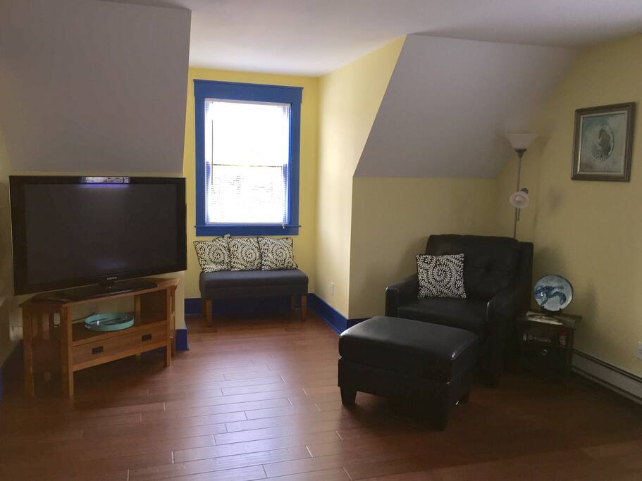 Second Room with 50" TV and Comfy Reading Area.