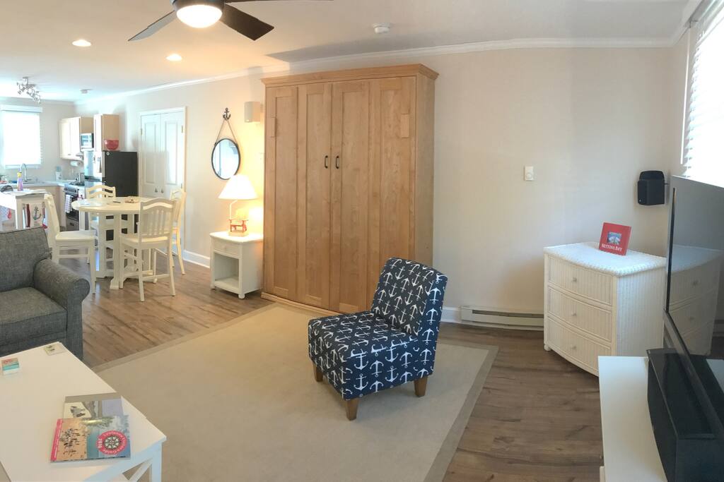 Living room with queen size Murphy bed and Serta mattress.