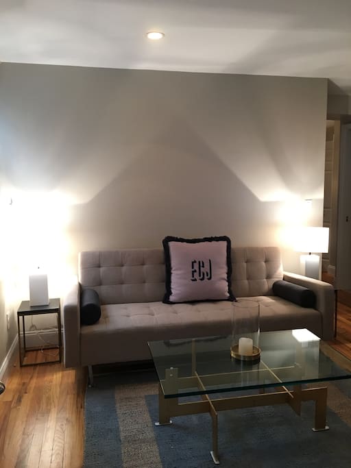 living room couch - pulls out to a lie flat queen bed, a bit hard but ok for overflow