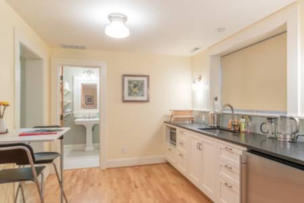 View from entryway toward kitchenette and bathroom.