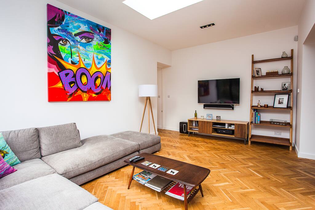 Living room with large sofa and TV.