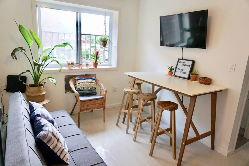 Natural light fills living room and dining bar with 40" TV with free Netflix and 50+ channels