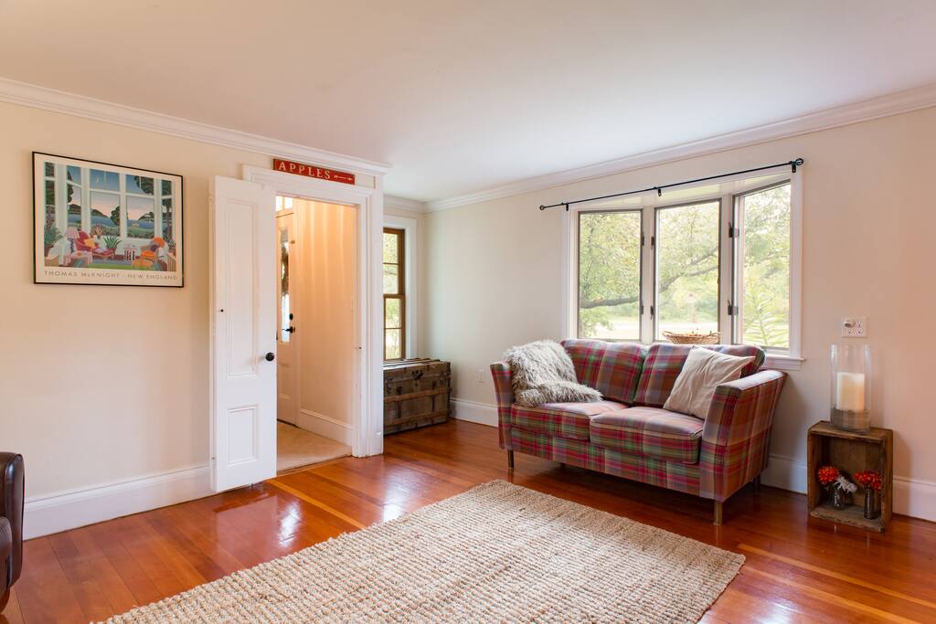 The living room overlooks the apple orchard.