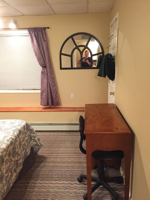 Looking into the bedroom.. you can sit at the desk for work if need be.