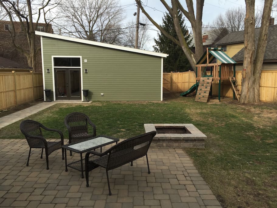 Large backed with garage and fire pit.
