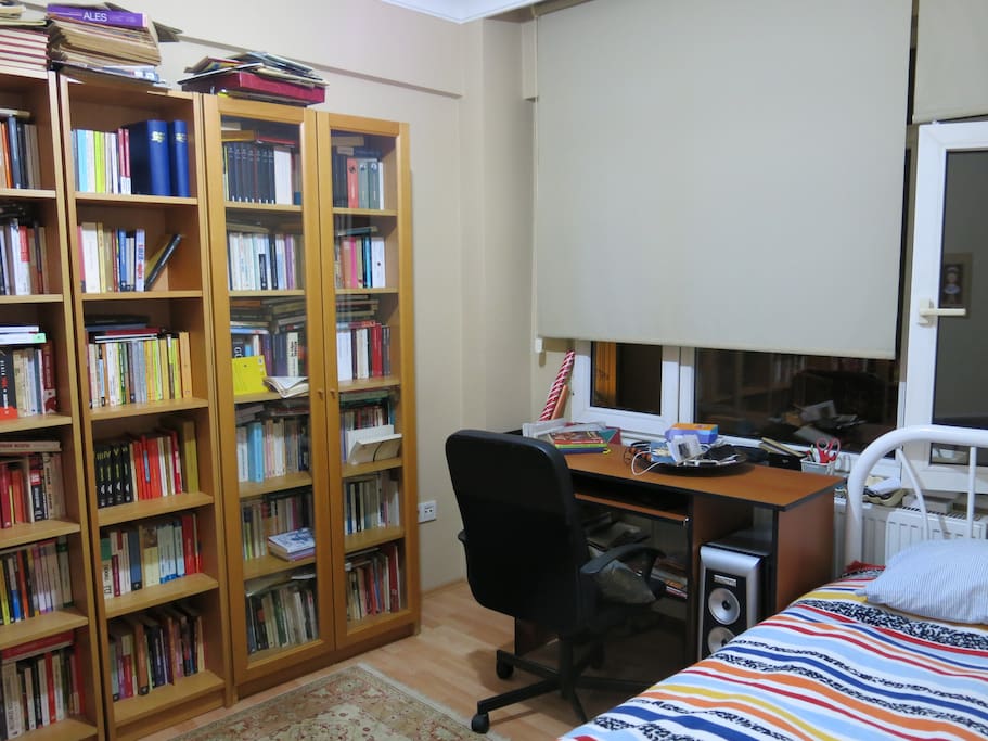 There is one bed and one working desk and chairs.