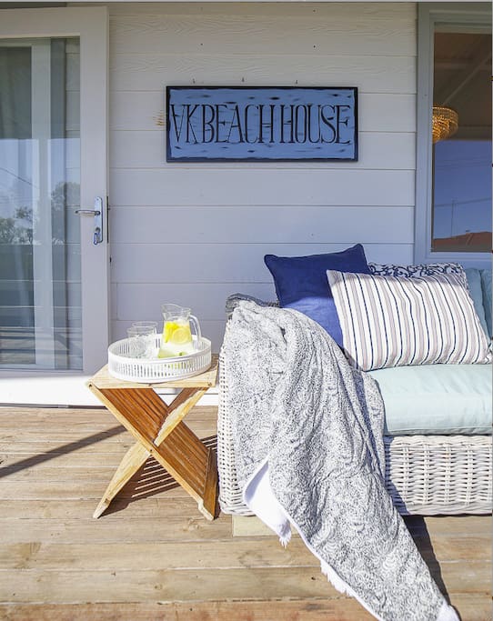 Outdoor upper level deck. Comfy outdoor lounge & lots of deck chairs.