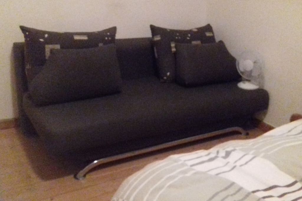couch bed , which is a two in one: a bed and a chair..