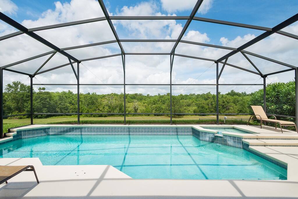 Enjoy the refreshing west-facing pool with a spillover spa