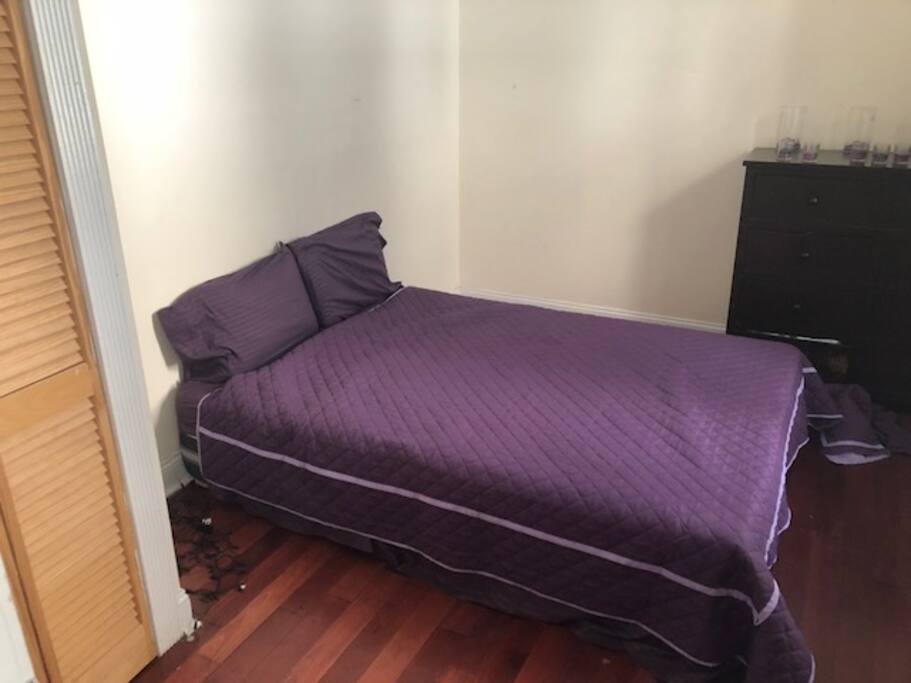bedroom 1. Queen sized bed. closet and dresser