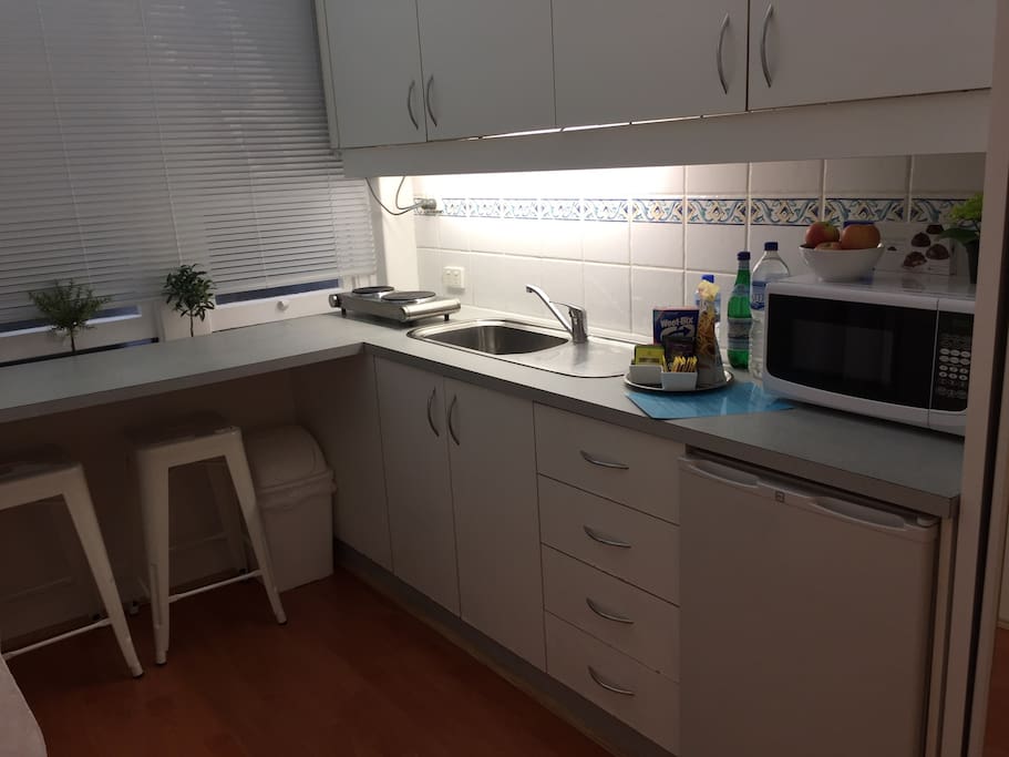 Clean eat in kitchen with tea and coffee making facilities.