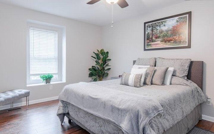 Elegant Queen bed room with desk