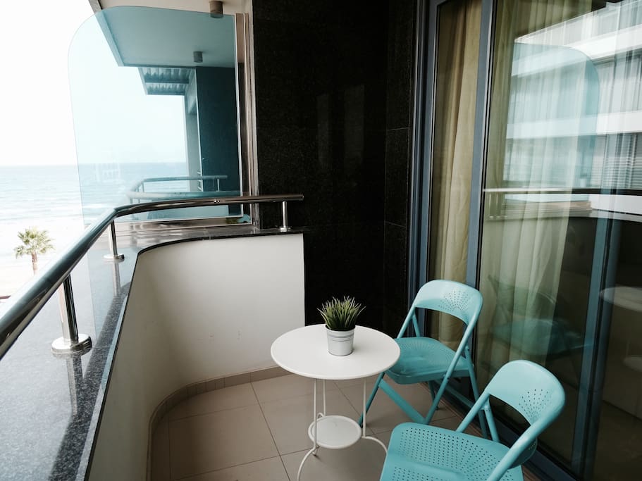 Balcony with side view of the beach