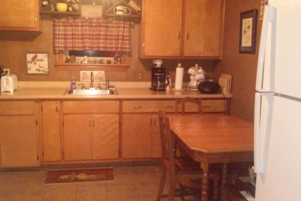 Full Service Eat-in Kitchen includes refrigerator/freezer, gas stove, microwave, can-opener, toaster and coffee maker.