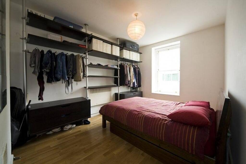 The bedroom features a large amount of storage.