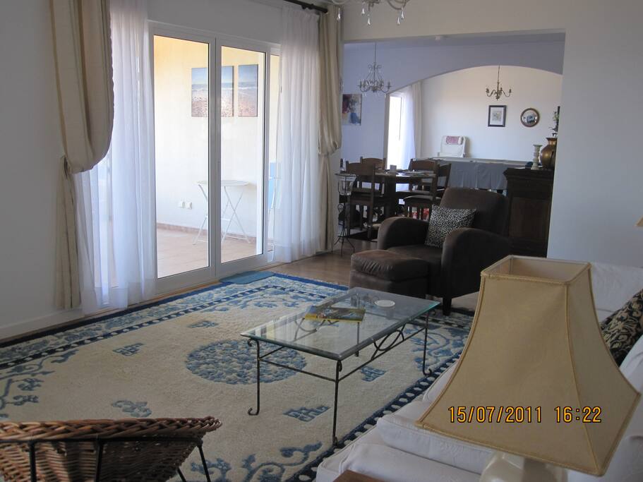 Living room looking through to dining room and games room