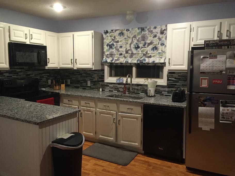 Newly renovated kitchen and new appliances with granite countertop.