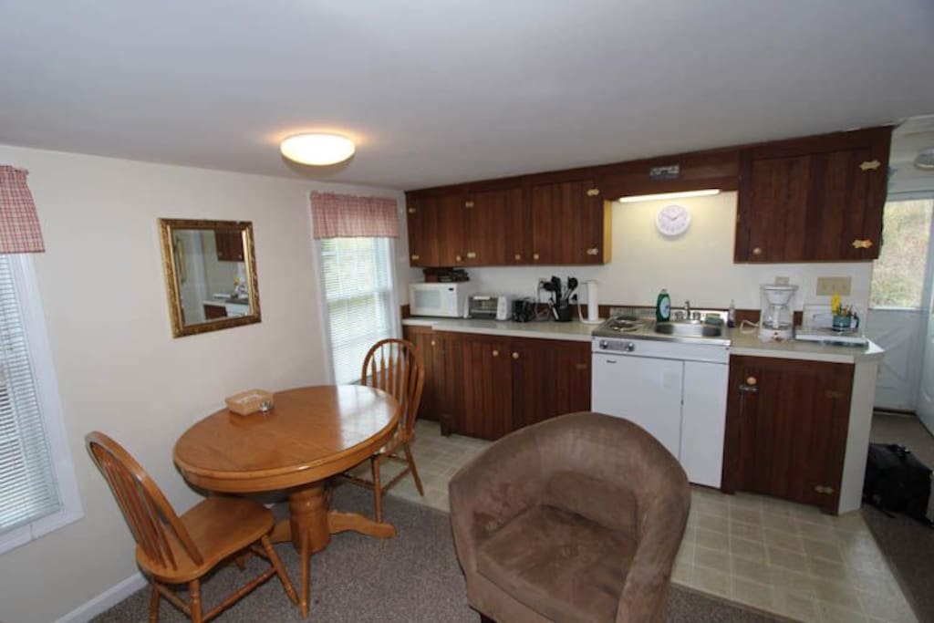 Efficiency style kitchen and dining area
