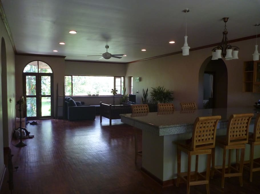 The kitchen area and a large, marble island with seating, opens into the great room/living room area with huge picture windows and excellent light.
