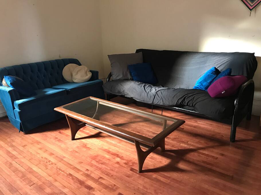 The living room has a plant nook, and home theatre, board games, yoga props and books for all ages. The futon can be used as an additional double bed.
