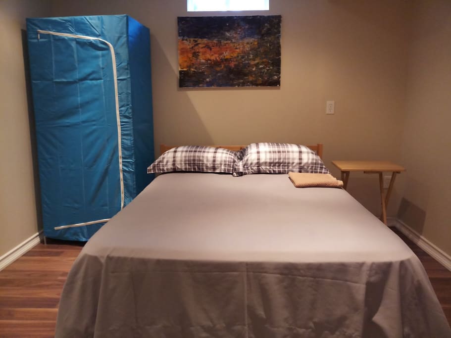cozy double bed and ikea wardrobe