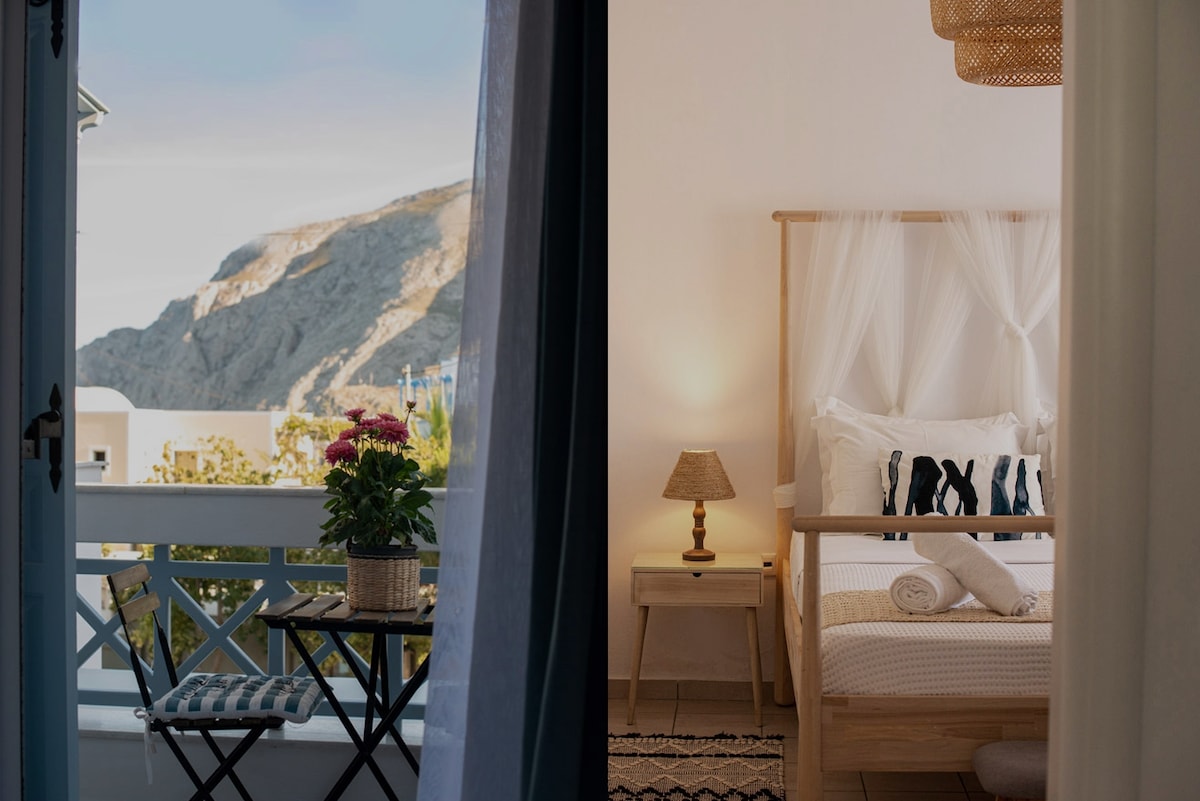 A balcony view showcases a mountain backdrop complemented by a potted plant on a small table. Adjacent, a serene sleeping area is presented, featuring a stylish bed with gauzy drapes, a bedside lamp, and soft tones that create a calming ambiance.