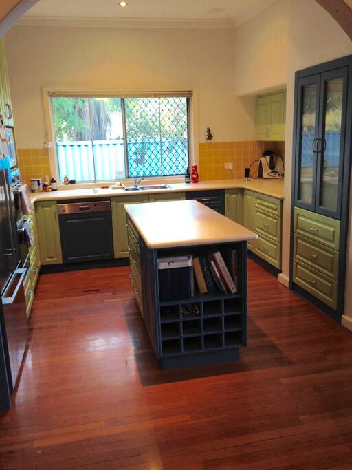 Large kitchen with all cooking utensils and crockery, toaster, kettle and dishwasher.