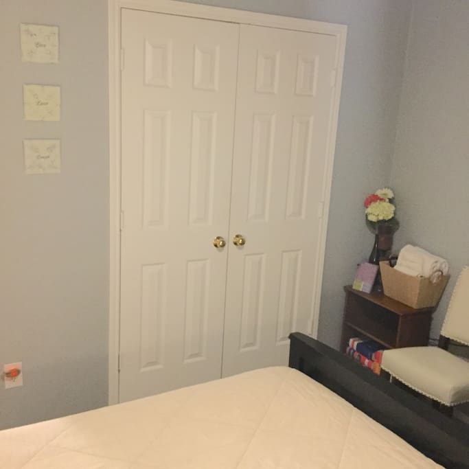 Closet space with organizers, drawers, and hangers