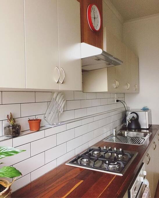 Our open kitchen, recently redone with recycled timber benches