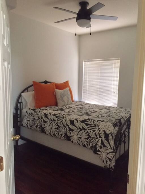 Very comfortable queen sized bed in one of the guest rooms.