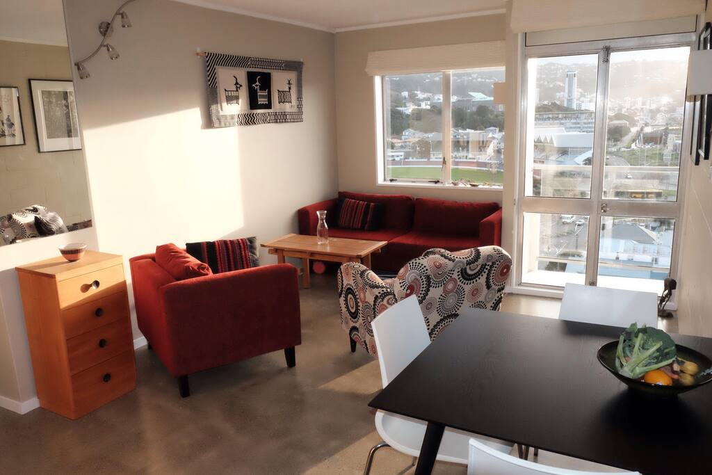 Open plan living and dining with small balcony