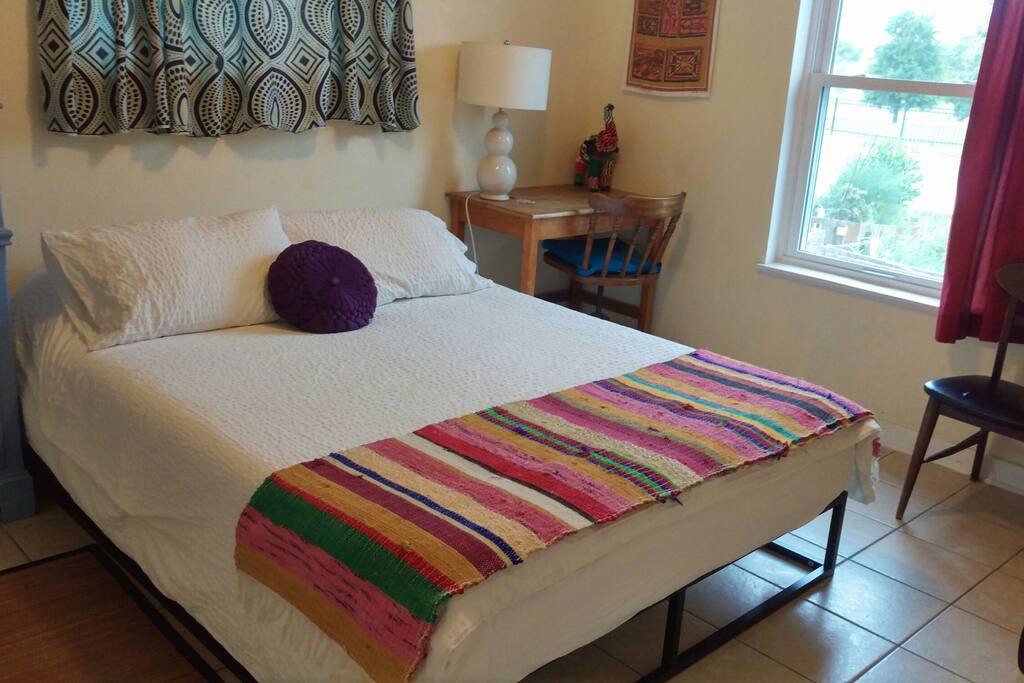 Queen bed in Peaches & Herb room.