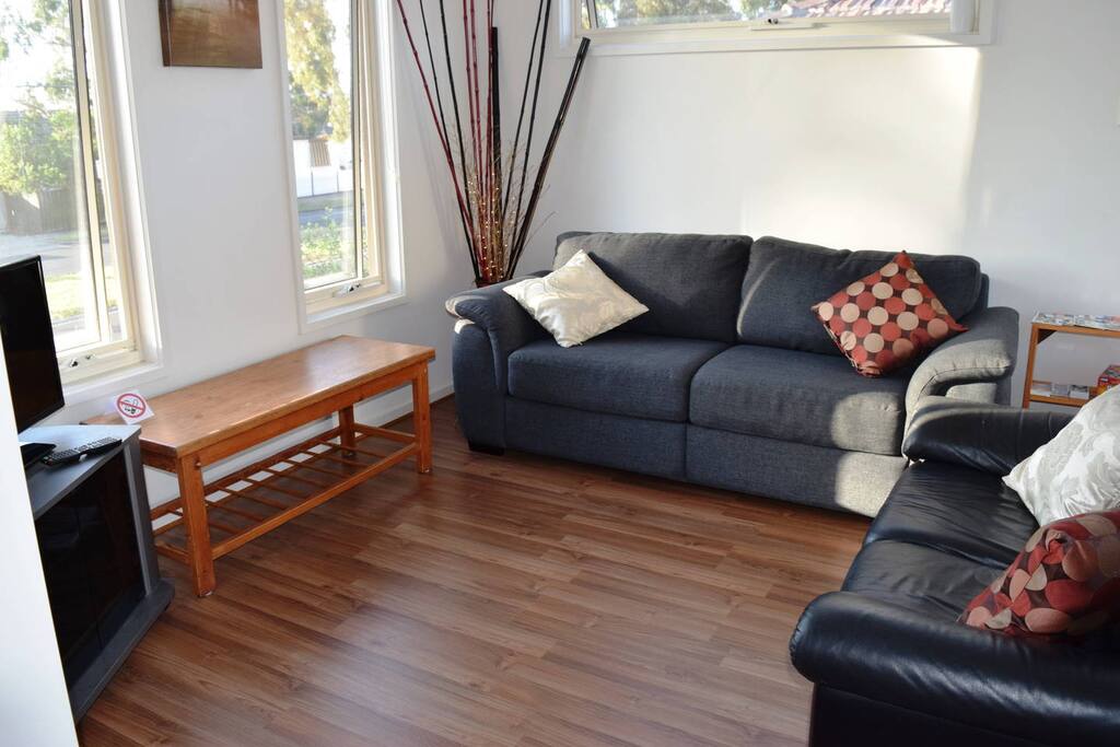 Main living area (upstairs): 2 couches, coffee table, TV and dvd player.