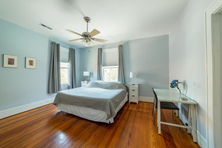 The blue bedroom has a king Tempurpedic bed, organic cotton bedding, a desk & chair, night tables & a serene feel. Twelve foot ceilings & original hardwoods are throughout the entire apartment. Each bedroom has light blocking drapes for dark sleeps.