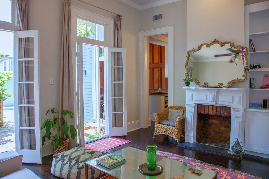 Airy living room with high ceilings, french doors, and vintage touches