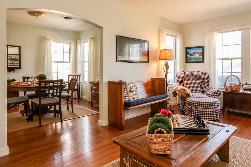 Beautifully furnished living room leads seamlessly into the dining room