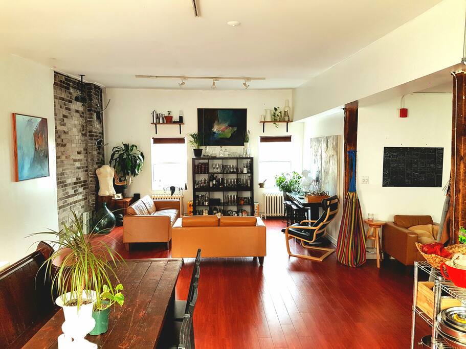 The main space is 1200sq ft with an outdoor rooftop patio, art room bar and harvest table.
