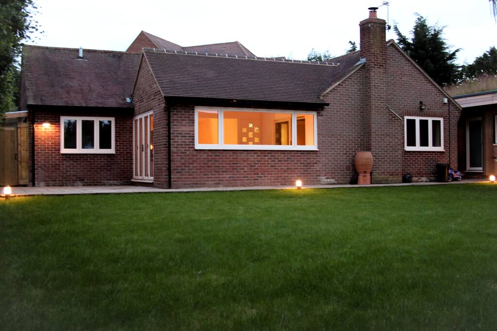 Rear view of the house. The garden totally closed in. Great for playing sports, night or day.