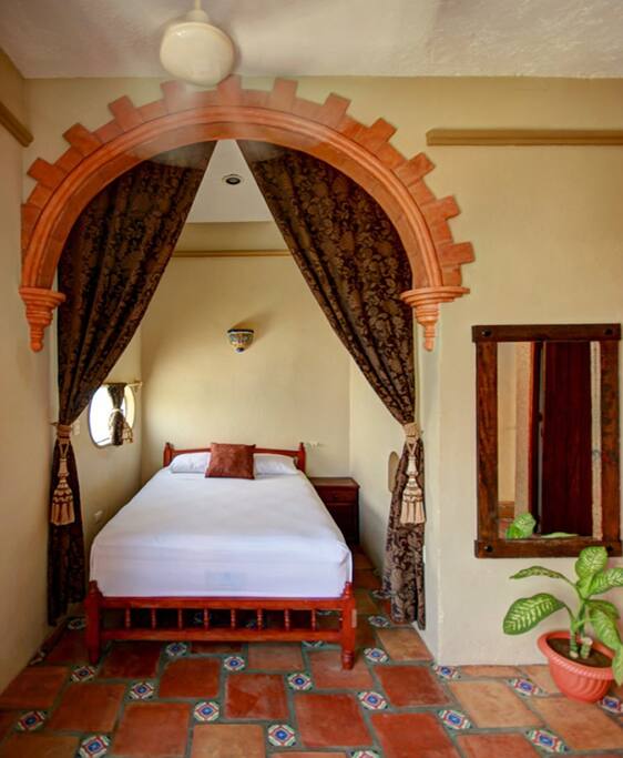 Comfortable Bed under archway